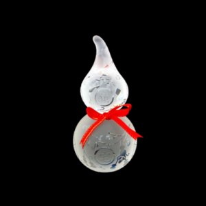 A clear crystal Wu Lou gourd, intricately designed with engraved patterns, symbolizing health and longevity in Feng Shui. The gourd is adorned with a bright red ribbon tied around its neck, enhancing its auspicious appearance. The Wu Lou is set against a black background, highlighting its elegant and delicate details, making it a perfect decorative item for promoting wellness and positive energy.